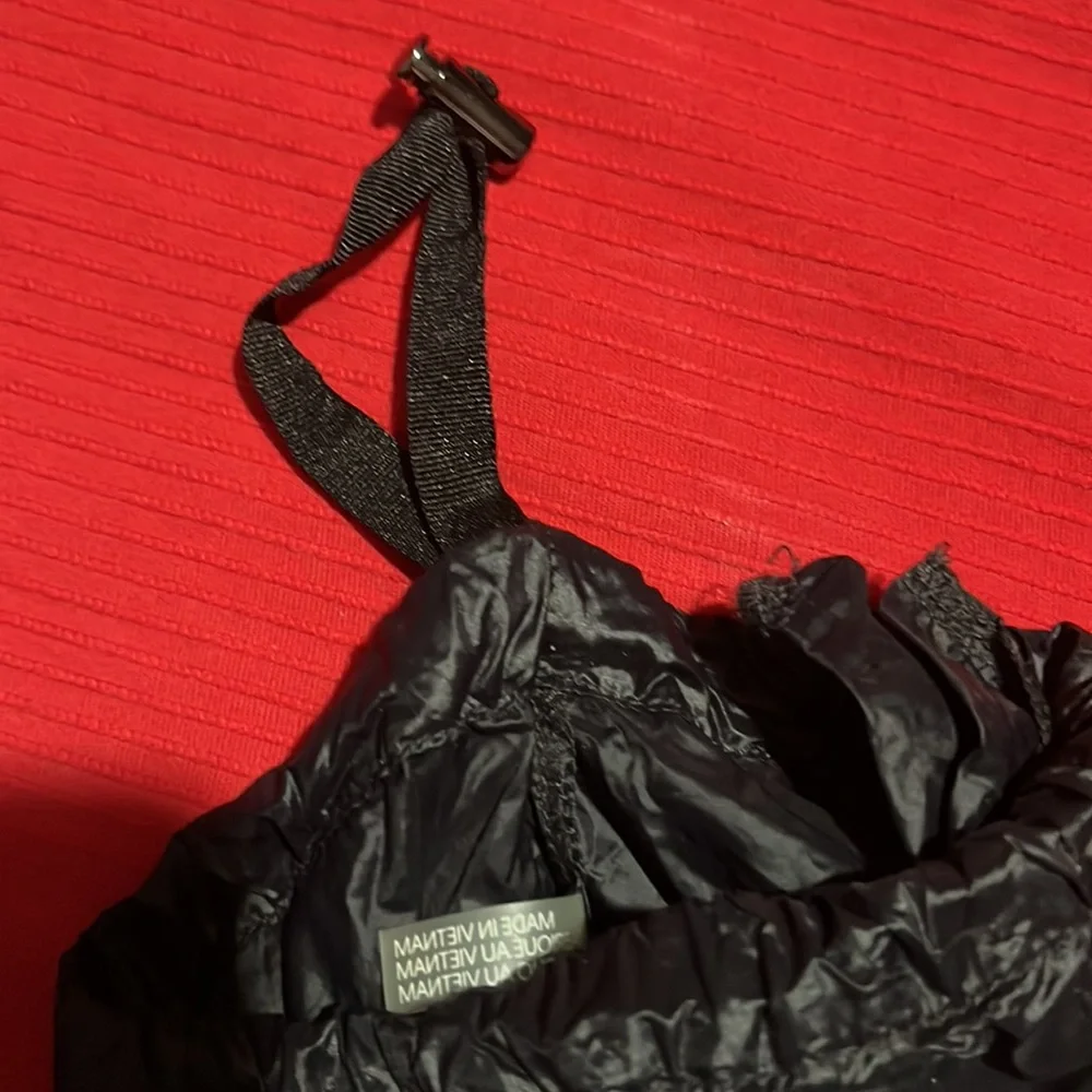 CK black draw string bag, used but great condition. Black and silver 12” x 5”